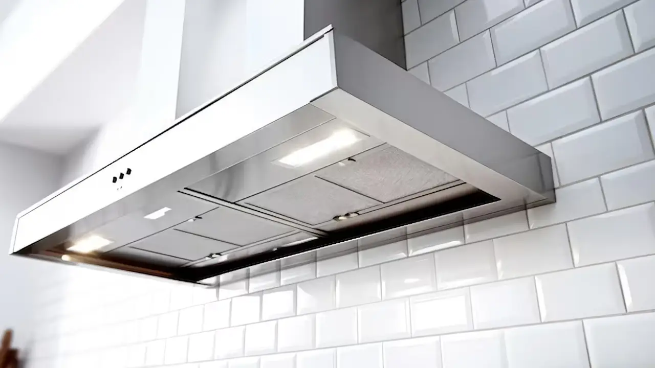 A Ductless Range Hood installed on a white tile wall